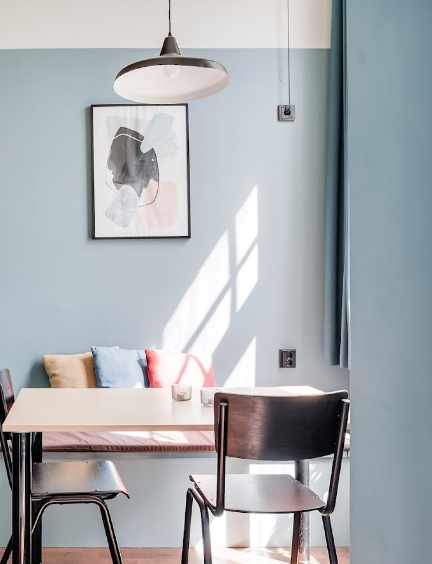 A sunlit dining nook at The Nooq Malmö